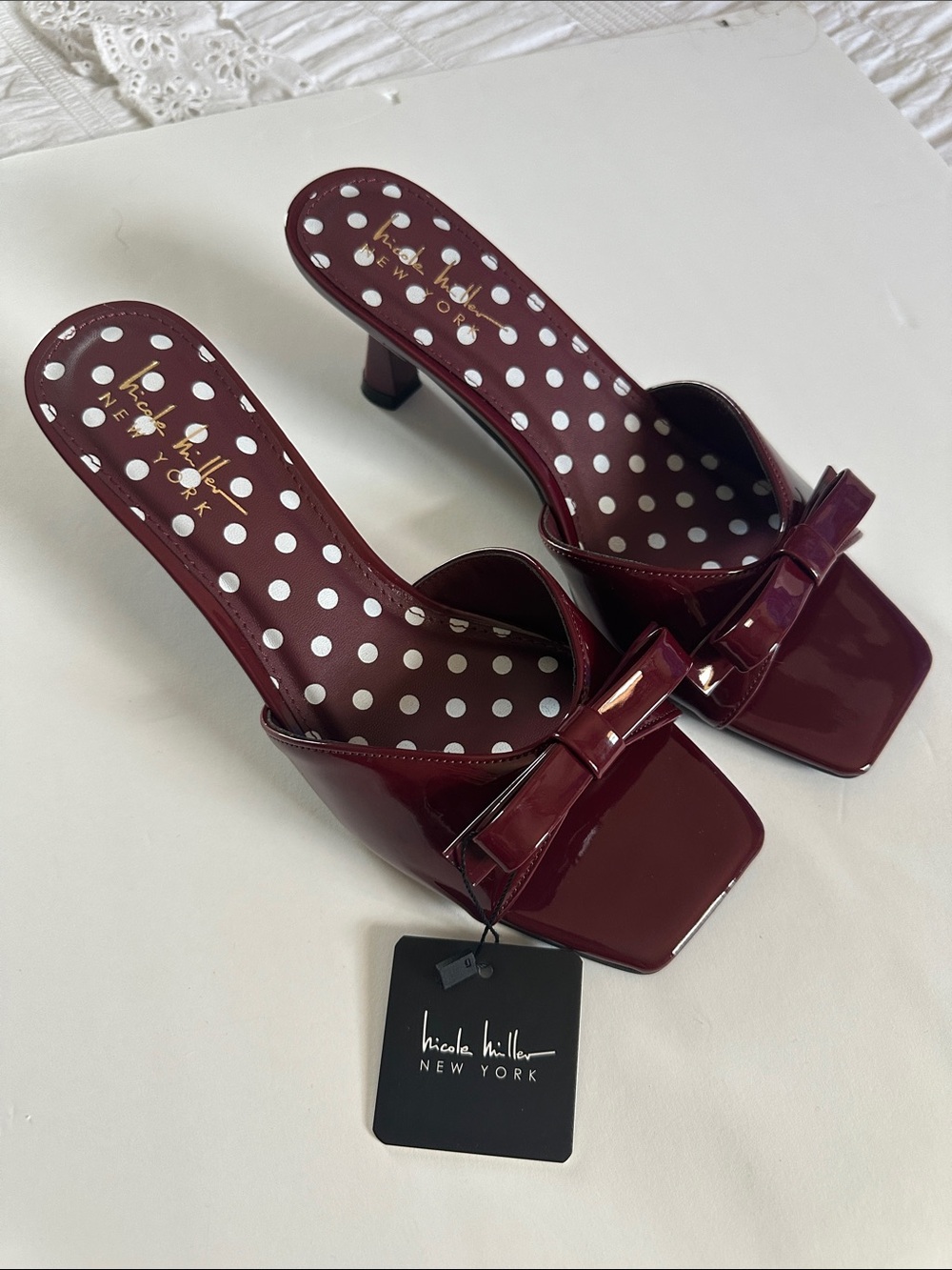 Nicole Miller Wine Patent Bow Mule Heels